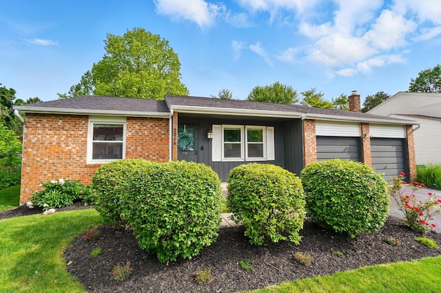 2216 Smoky View Blvd, Powell, OH 43065 - single story home featuring a garage, brick siding, and board and batten siding