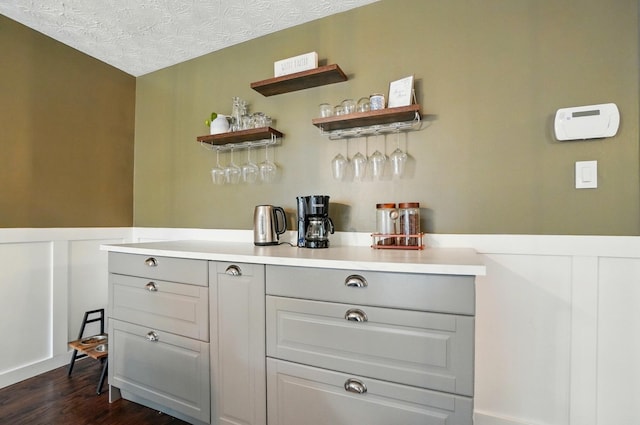 2216 Smoky View Blvd, Powell, OH 43065 - indoor dry bar featuring dark wood finished floors and a textured ceiling