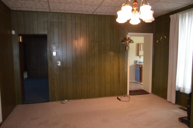 5810 Bickle Church Rd NW, Pickerington, OH 43147 - carpeted empty room with a chandelier and wooden walls