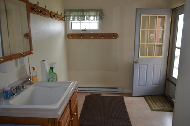 5810 Bickle Church Rd NW, Pickerington, OH 43147 - bathroom with a baseboard heating unit and vanity
