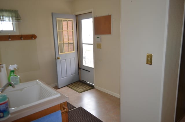 5810 Bickle Church Rd NW, Pickerington, OH 43147 - laundry room with baseboards, a sink, and light floors