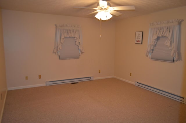 5810 Bickle Church Rd NW, Pickerington, OH 43147 - spare room featuring a baseboard radiator, a ceiling fan, carpet floors, and baseboards