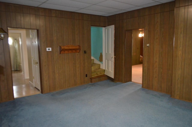 5810 Bickle Church Rd NW, Pickerington, OH 43147 - unfurnished room with wooden walls, carpet flooring, and stairs