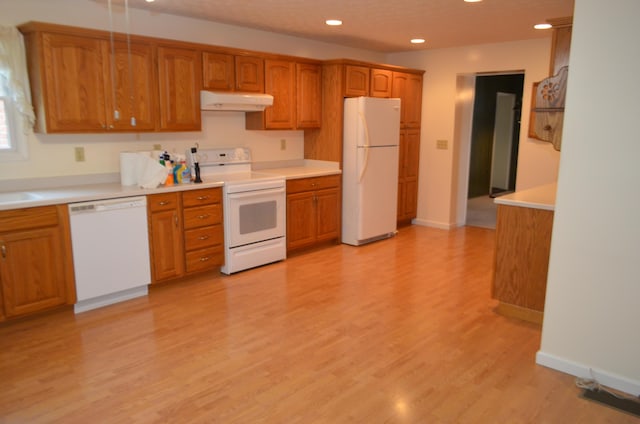 5810 Bickle Church Rd NW, Pickerington, OH 43147 - kitchen featuring white appliances, brown cabinets, light wood-style flooring, recessed lighting, and under cabinet range hood