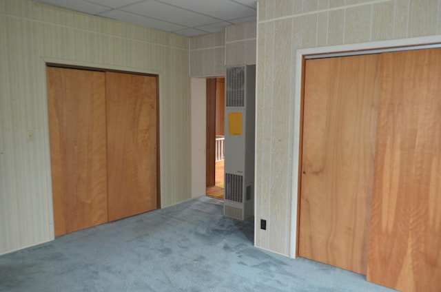 5810 Bickle Church Rd NW, Pickerington, OH 43147 - unfurnished bedroom featuring a heating unit, carpet flooring, a drop ceiling, and multiple closets