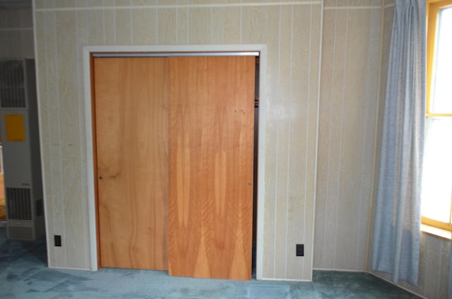 5810 Bickle Church Rd NW, Pickerington, OH 43147 - unfurnished bedroom with a heating unit, carpet floors, a closet, and multiple windows