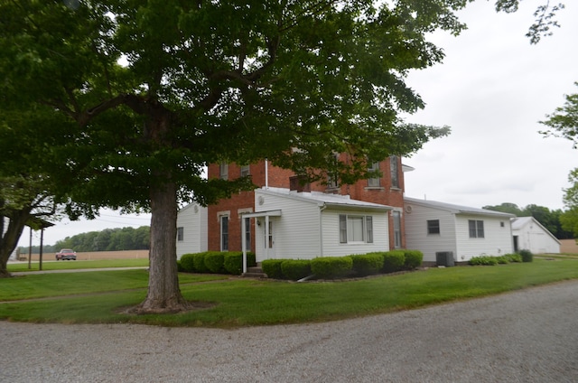 5810 Bickle Church Rd NW, Pickerington, OH 43147 - view of front facade with a front lawn and central AC