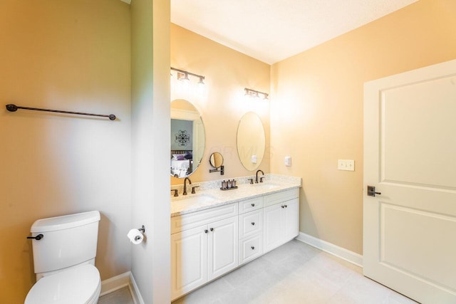 3750 Echo Pl, Powell, OH 43065 - bathroom with double vanity, toilet, and baseboards