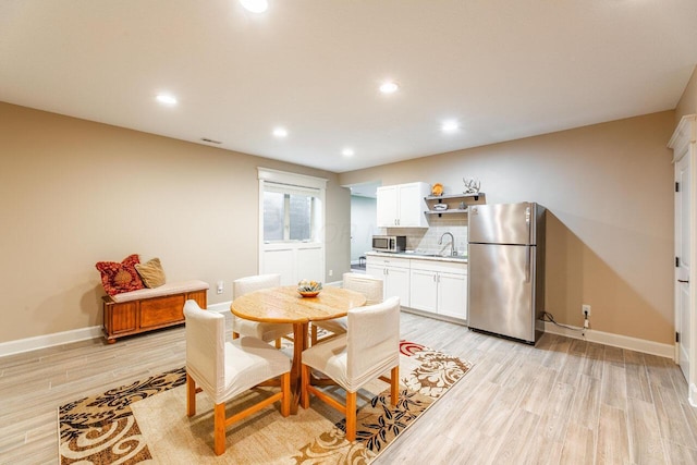 3750 Echo Pl, Powell, OH 43065 - dining area with light wood finished floors, baseboards, and recessed lighting