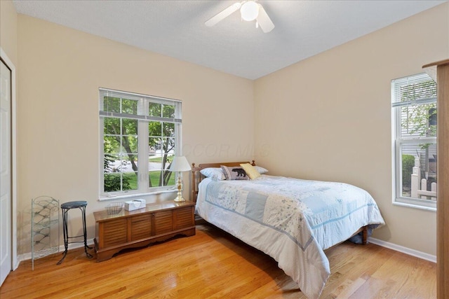 2880 Longridge Way, Grove City, OH 43123 - bedroom featuring light wood-type flooring, multiple windows, baseboards, and ceiling fan