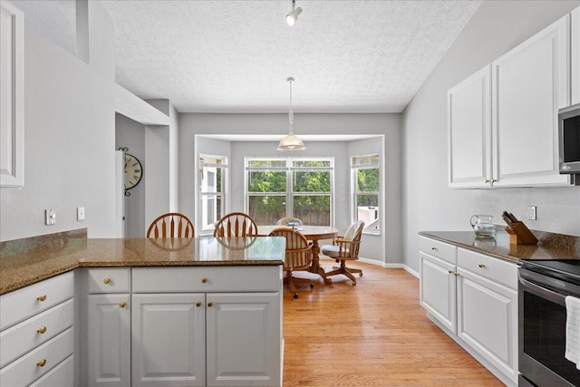 2880 Longridge Way, Grove City, OH 43123 - kitchen featuring appliances with stainless steel finishes, white cabinets, and a textured ceiling