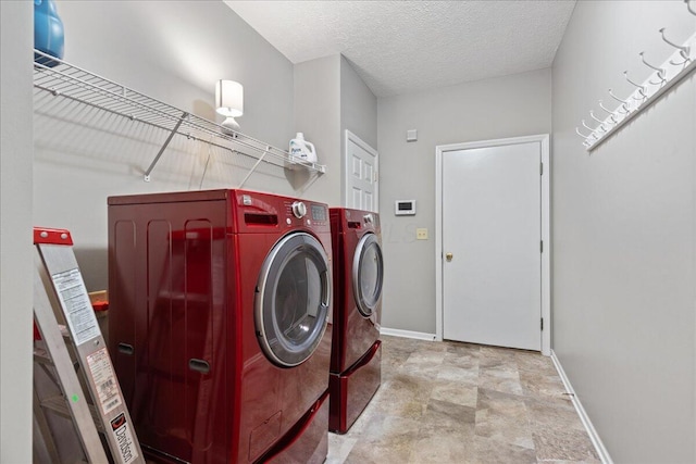 2880 Longridge Way, Grove City, OH 43123 - washroom featuring washer and dryer, baseboards, a textured ceiling, and stone finish floors