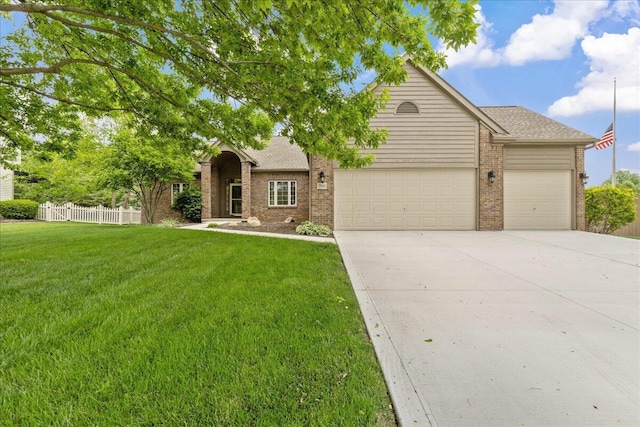 2880 Longridge Way, Grove City, OH 43123 - view of front facade with a garage, brick siding, driveway, and a shingled roof