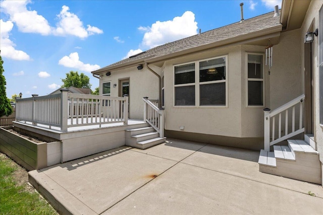 2880 Longridge Way, Grove City, OH 43123 - rear view of property with a patio area, stucco siding, a wooden deck, and roof with shingles