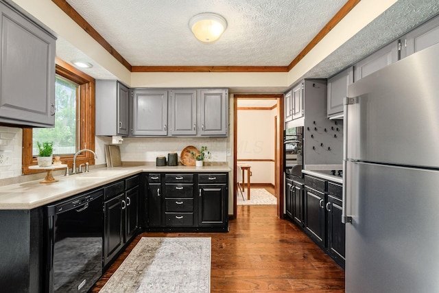 6392 Hilltop Ave, Reynoldsburg, OH 43068 - kitchen featuring black appliances, a textured ceiling, dark wood-style floors, light countertops, and gray cabinets