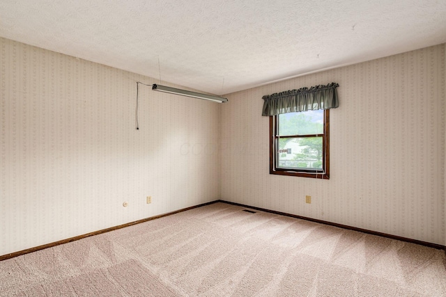 6392 Hilltop Ave, Reynoldsburg, OH 43068 - carpeted spare room with a textured ceiling