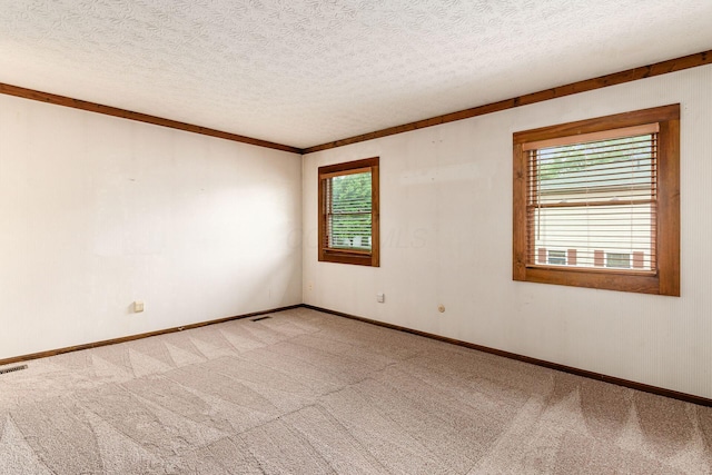 6392 Hilltop Ave, Reynoldsburg, OH 43068 - unfurnished room with plenty of natural light, light colored carpet, a textured ceiling, and baseboards