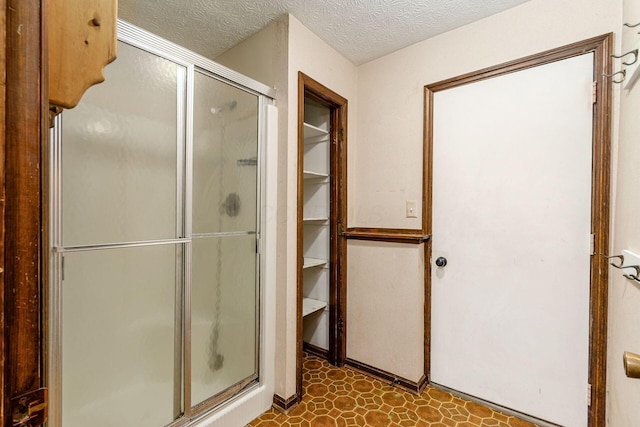 6392 Hilltop Ave, Reynoldsburg, OH 43068 - full bathroom with a shower stall, a textured ceiling, and tile patterned floors