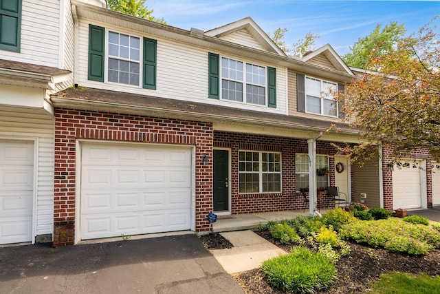 642 Grove Cir Unit 1902, Columbus, OH 43230 - townhome / multi-family property featuring brick siding and driveway