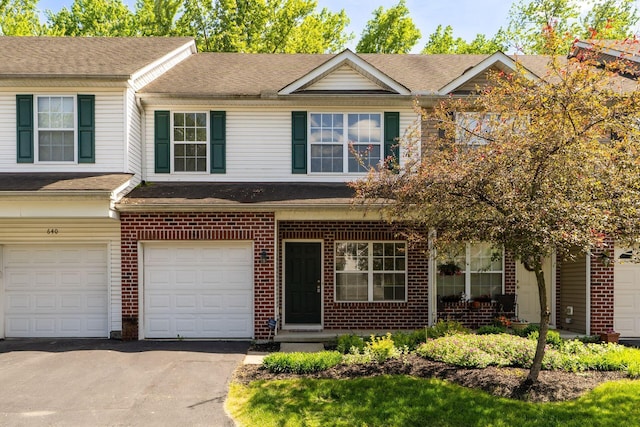 642 Grove Cir Unit 1902, Columbus, OH 43230 - multi unit property with an attached garage, brick siding, driveway, and roof with shingles