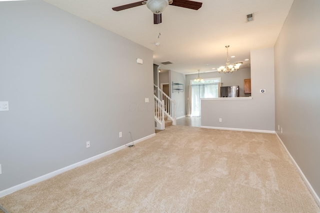 642 Grove Cir Unit 1902, Columbus, OH 43230 - spare room with a chandelier, light carpet, a ceiling fan, stairs, and baseboards