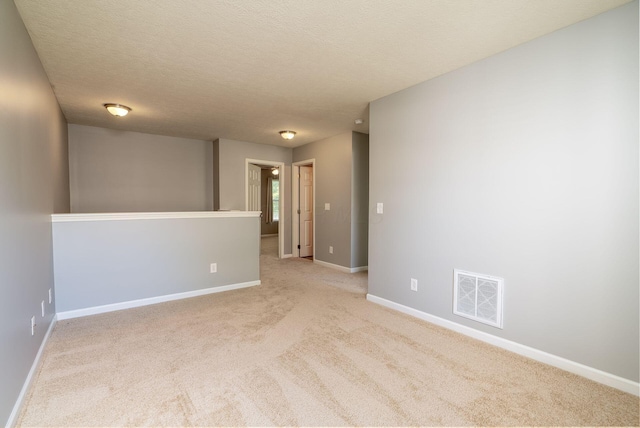 642 Grove Cir Unit 1902, Columbus, OH 43230 - spare room with baseboards, carpet floors, and a textured ceiling