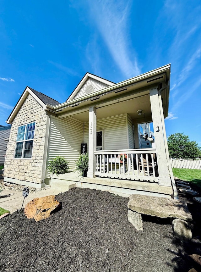 1522 E Quail Run Dr, Newark, OH 43055 - view of front of home featuring a porch and stone siding