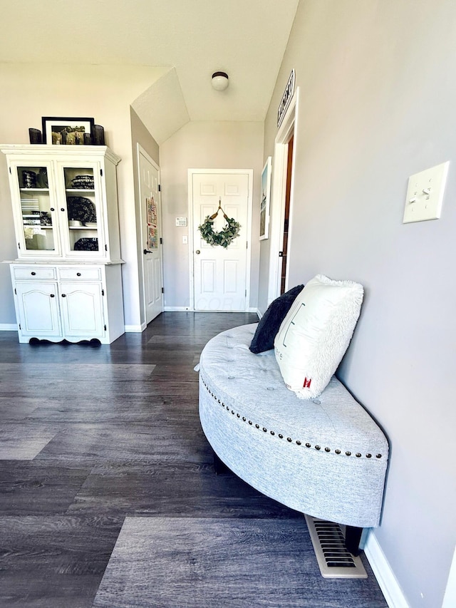 1522 E Quail Run Dr, Newark, OH 43055 - sitting room with dark wood finished floors, baseboards, and lofted ceiling