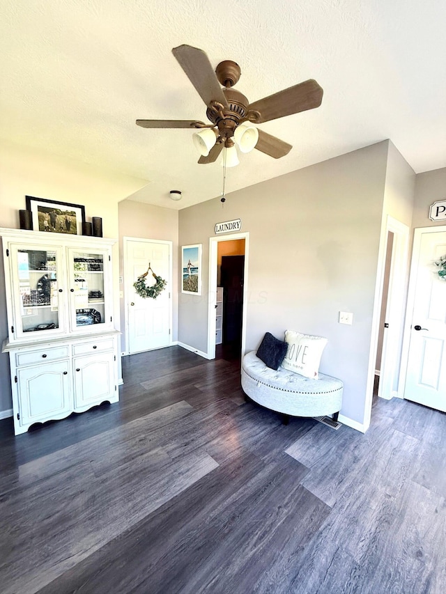 1522 E Quail Run Dr, Newark, OH 43055 - living area with baseboards, ceiling fan, and dark wood finished floors
