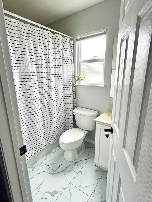 1522 E Quail Run Dr, Newark, OH 43055 - full bathroom featuring toilet, vanity, marble look tile flooring, and a shower with shower curtain