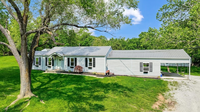 1036 State Route 247, Hillsboro, OH 45133 - ranch-style home with an attached carport, dirt driveway, a front lawn, and a metal roof