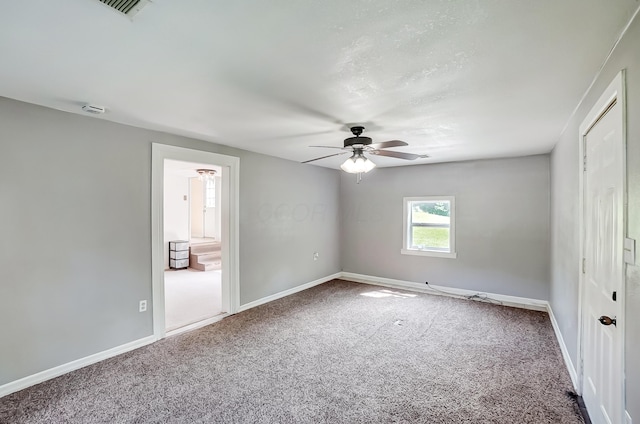 1036 State Route 247, Hillsboro, OH 45133 - unfurnished bedroom with carpet, connected bathroom, and ceiling fan