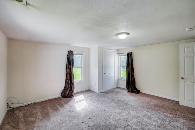 1036 State Route 247, Hillsboro, OH 45133 - unfurnished room featuring carpet, healthy amount of natural light, a textured ceiling, and a smoke detector