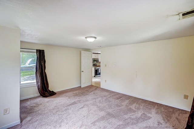 1036 State Route 247, Hillsboro, OH 45133 - unfurnished room featuring light colored carpet and baseboards