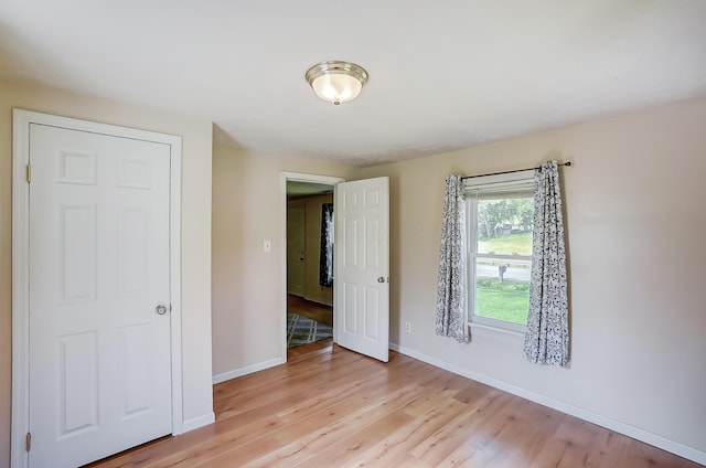 1036 State Route 247, Hillsboro, OH 45133 - unfurnished bedroom with light wood-style floors and baseboards