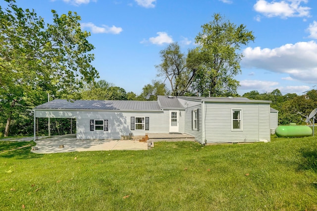1036 State Route 247, Hillsboro, OH 45133 - back of house with a patio area, a yard, and a metal roof