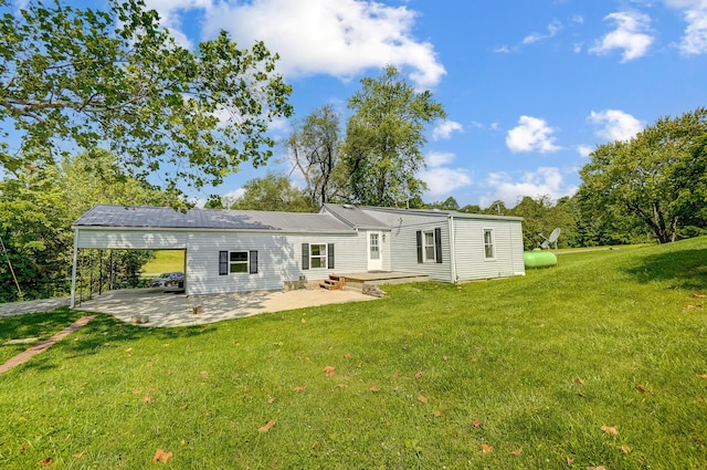 1036 State Route 247, Hillsboro, OH 45133 - rear view of property with a patio, a yard, and a carport