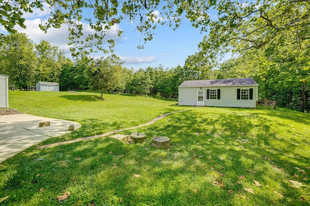 1036 State Route 247, Hillsboro, OH 45133 - view of green lawn featuring a patio area and a shed