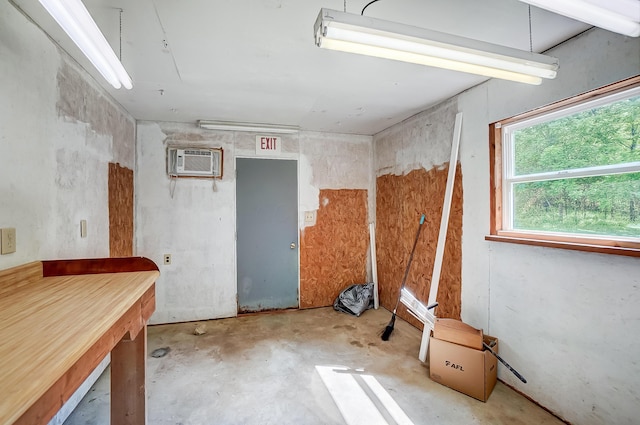 1036 State Route 247, Hillsboro, OH 45133 - misc room featuring a wall mounted air conditioner and concrete floors