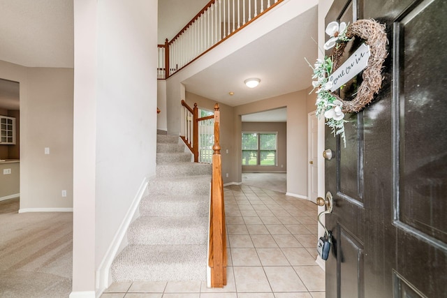 56 Dellenbaugh Loop, Etna, OH 43062 - foyer entrance featuring stairs, baseboards, light carpet, and light tile patterned flooring