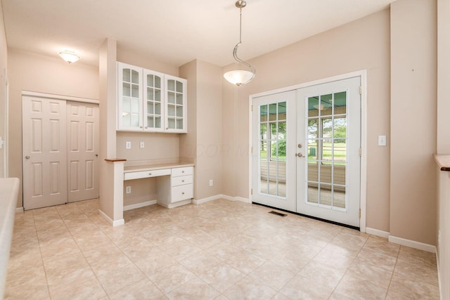 56 Dellenbaugh Loop, Etna, OH 43062 - unfurnished dining area featuring french doors, light tile patterned floors, and baseboards