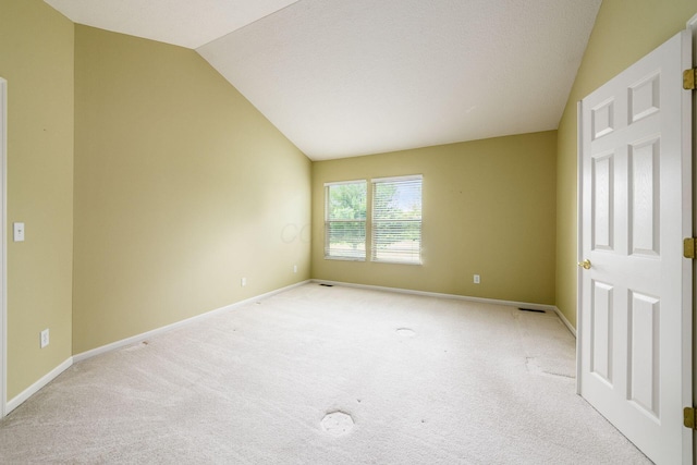 56 Dellenbaugh Loop, Etna, OH 43062 - empty room featuring vaulted ceiling, light carpet, and baseboards