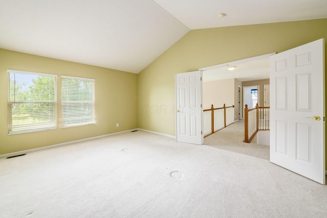 56 Dellenbaugh Loop, Etna, OH 43062 - spare room featuring vaulted ceiling, light carpet, baseboards, and a smoke detector