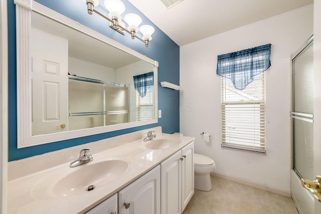 56 Dellenbaugh Loop, Etna, OH 43062 - full bath with double vanity, toilet, baseboards, tile patterned flooring, and enclosed tub / shower combo