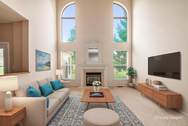 56 Dellenbaugh Loop, Etna, OH 43062 - living room featuring a high ceiling, plenty of natural light, a fireplace, and baseboards