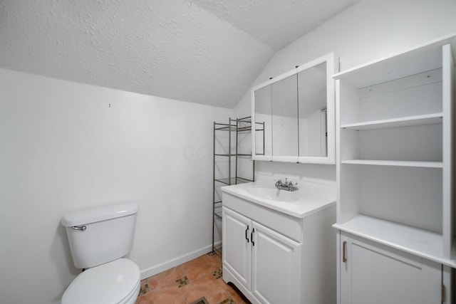 173 Highland Ave, Buckeye Lake, OH 43008 - bathroom with vanity, a textured ceiling, toilet, lofted ceiling, and baseboards