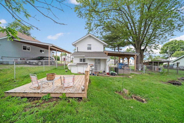 173 Highland Ave, Buckeye Lake, OH 43008 - rear view of house with a hot tub, a deck, and a carport