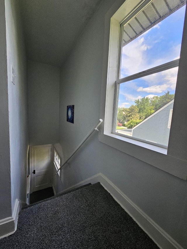 2889 E 12th Ave, Columbus, OH 43219 - staircase featuring baseboards