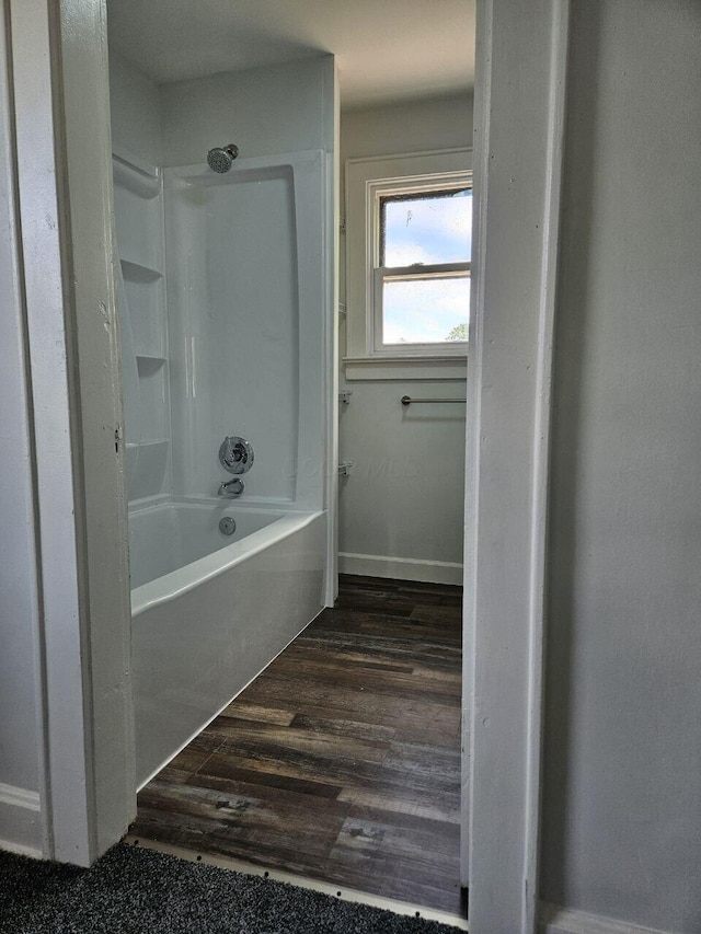 2889 E 12th Ave, Columbus, OH 43219 - full bathroom featuring washtub / shower combination and wood finished floors