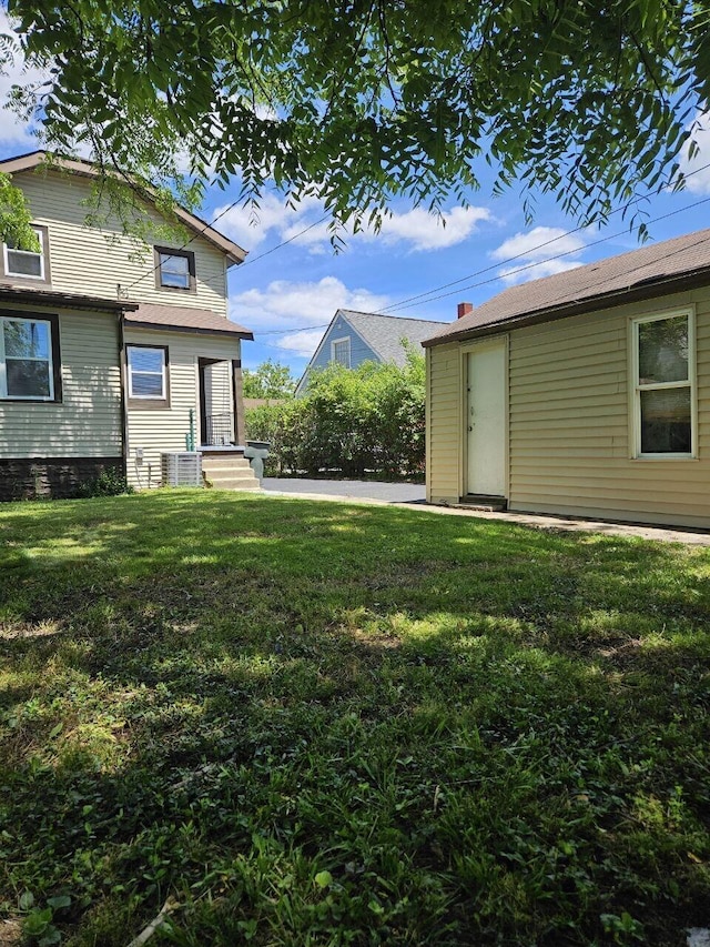 2889 E 12th Ave, Columbus, OH 43219 - view of grassy yard with central AC unit